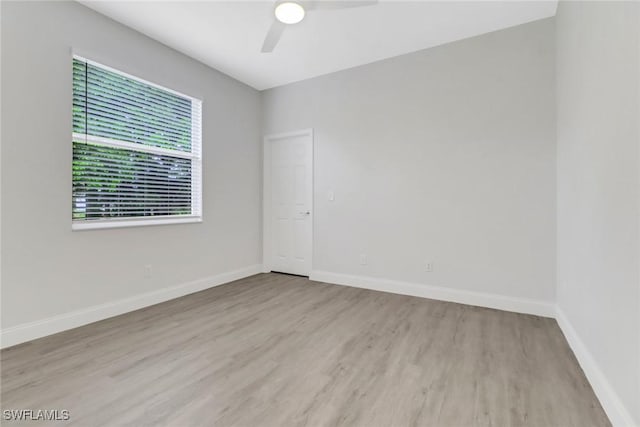 spare room with ceiling fan and light hardwood / wood-style floors