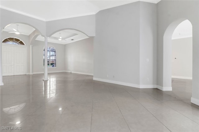 unfurnished room with ceiling fan, light tile patterned floors, and crown molding