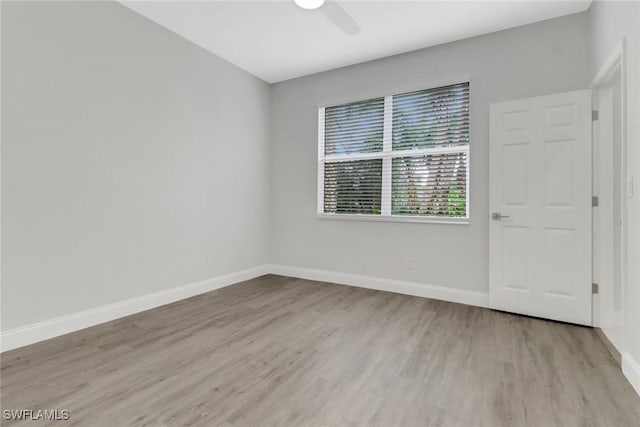 unfurnished room with ceiling fan and light hardwood / wood-style flooring