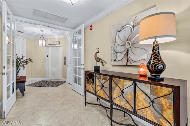 2550 Marquesa Royale Ln Unit 8-101, Naples, FL 34109 - foyer with tile patterned flooring, ornamental molding, visible vents, elevator, and french doors