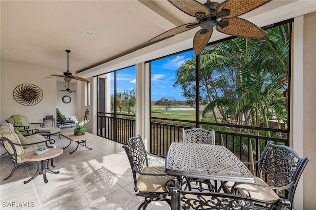 sunroom featuring ceiling fan