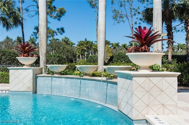 view of pool featuring pool water feature