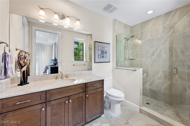 2550 Marquesa Royale Ln Unit 8-101, Naples, FL 34109 - full bathroom with visible vents, vanity, toilet, tiled shower, and recessed lighting