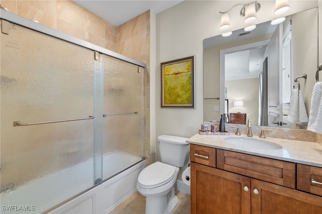 full bathroom featuring bath / shower combo with glass door, vanity, and toilet