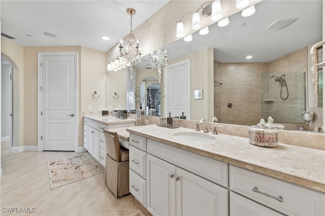 bathroom featuring vanity and a tile shower