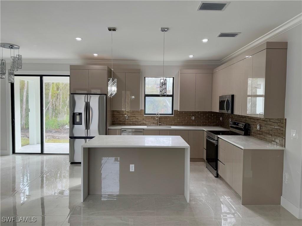 kitchen featuring pendant lighting, a notable chandelier, gray cabinetry, and stainless steel appliances