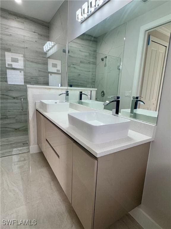 bathroom featuring vanity and a shower with shower door