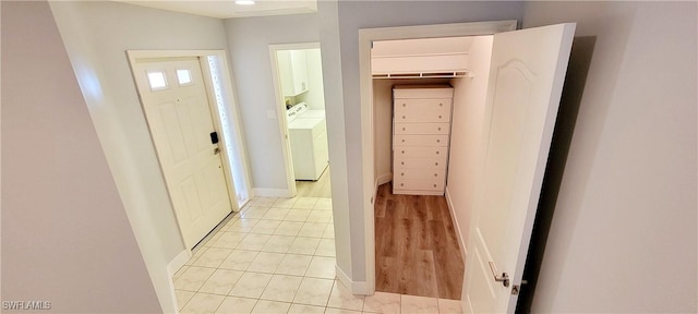 hallway featuring washer and clothes dryer