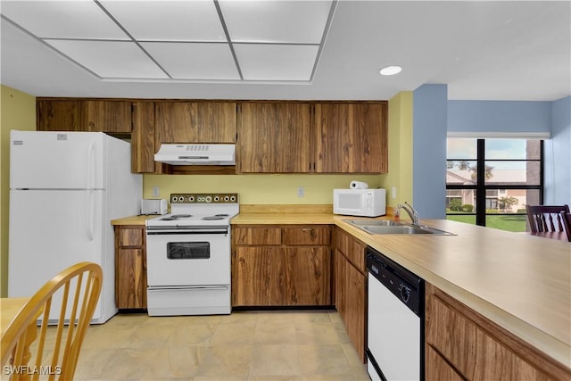 kitchen with white appliances and sink