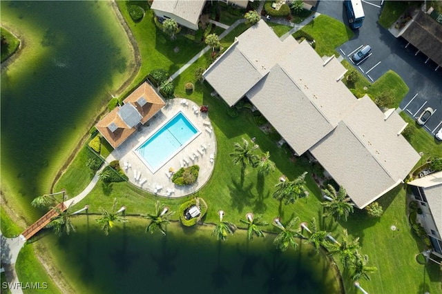 birds eye view of property with a water view