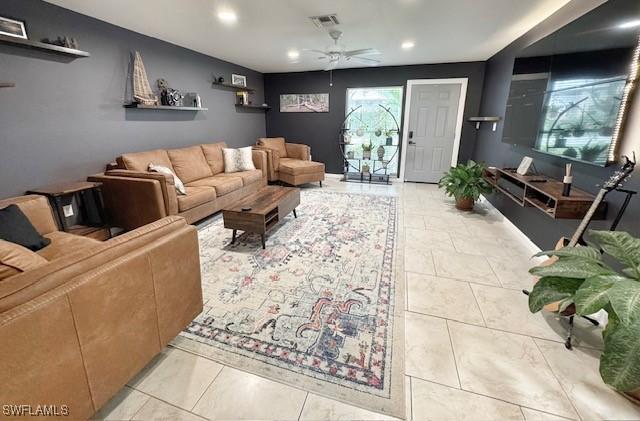 living room with light tile patterned flooring and ceiling fan