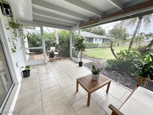 sunroom / solarium with beam ceiling