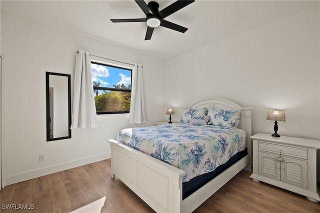 bedroom featuring hardwood / wood-style flooring and ceiling fan