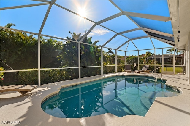 view of pool featuring a lanai and a patio area