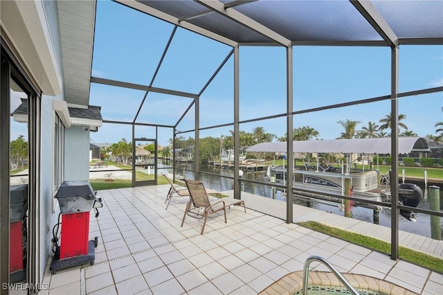 view of patio / terrace featuring a water view, a dock, and glass enclosure