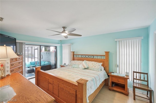 4925 SW 11th Ave, Cape Coral, FL 33914 - bedroom with access to outside, light wood-style flooring, and a ceiling fan