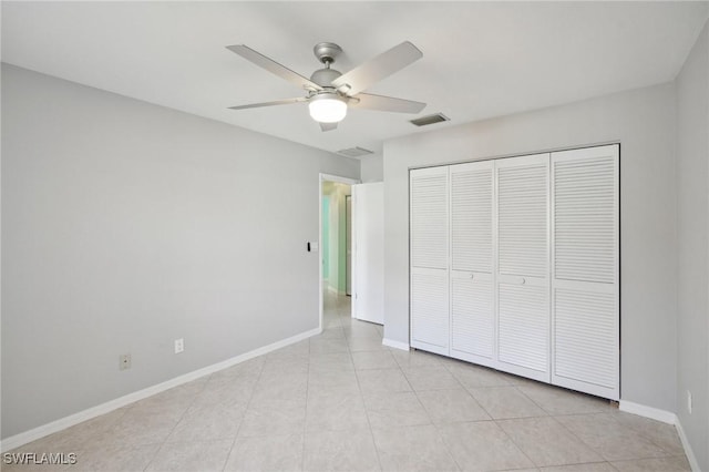 unfurnished bedroom featuring a closet and ceiling fan