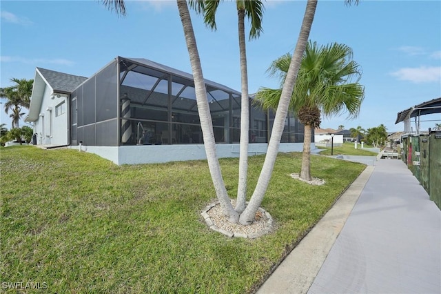 4925 SW 11th Ave, Cape Coral, FL 33914 - view of home's exterior featuring a lawn and a lanai