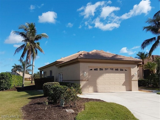 view of property exterior with a lawn and a garage