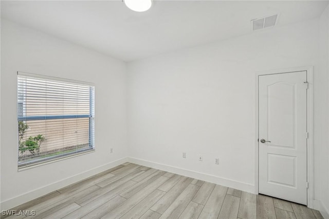 unfurnished room featuring light hardwood / wood-style floors