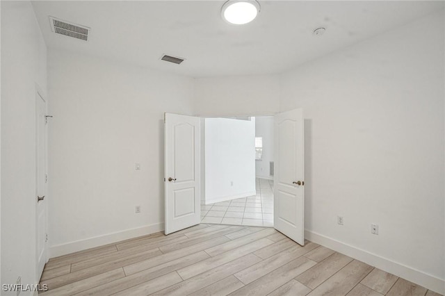 empty room featuring light hardwood / wood-style floors