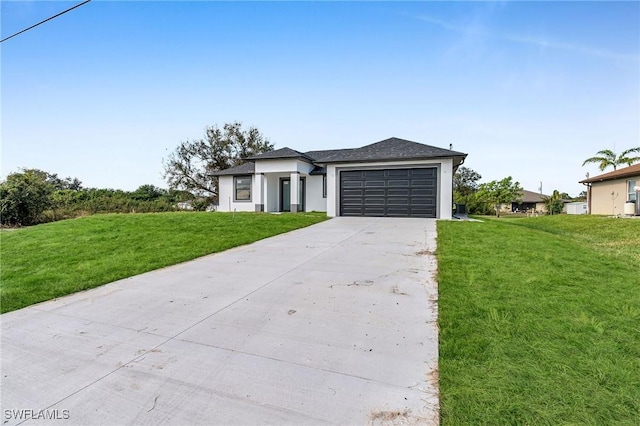 view of front facade featuring a garage and a front lawn