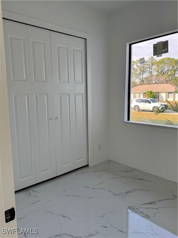 unfurnished bedroom featuring a closet