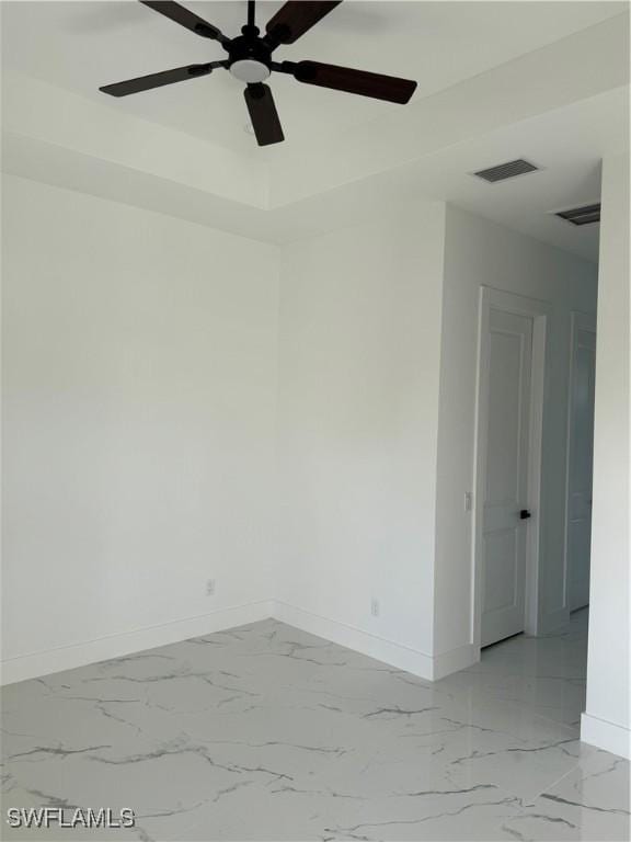 spare room with ceiling fan