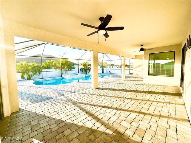 view of swimming pool with a patio, ceiling fan, and an in ground hot tub