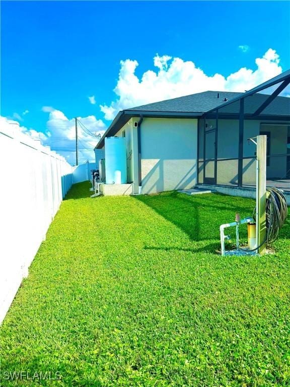 view of yard featuring a lanai