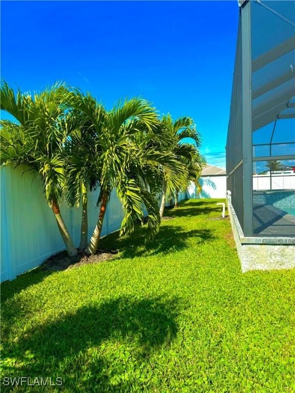 view of yard featuring a lanai