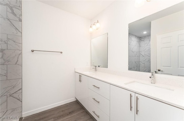 bathroom featuring vanity and wood-type flooring