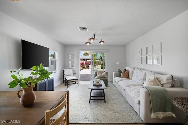 living room featuring an inviting chandelier