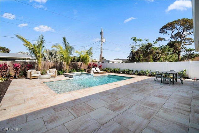 view of swimming pool with an in ground hot tub and a patio area