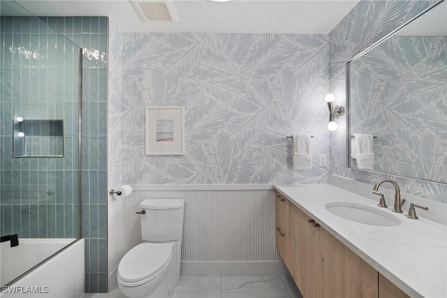 full bathroom with vanity, combined bath / shower with glass door, and toilet