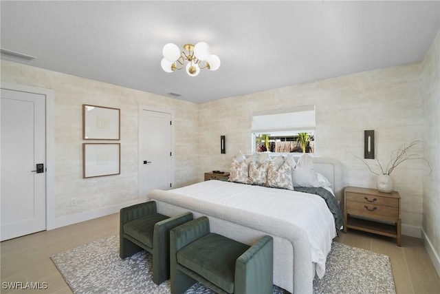 bedroom with an inviting chandelier