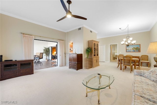 living room featuring carpet flooring, ceiling fan with notable chandelier, and crown molding