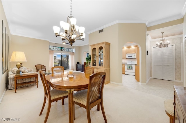 carpeted dining area with crown molding and a chandelier