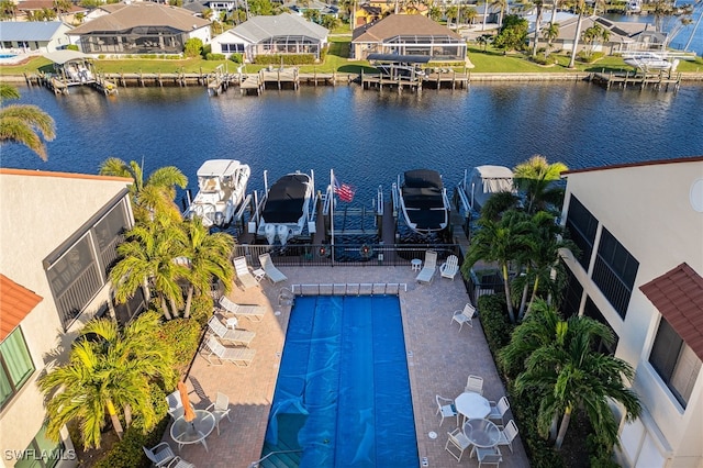 birds eye view of property with a water view