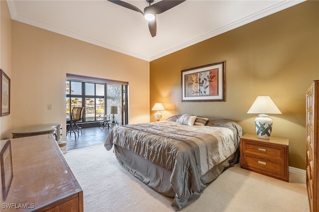 carpeted bedroom featuring ceiling fan and crown molding