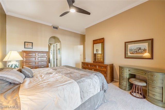 bedroom with ceiling fan, light carpet, and ornamental molding