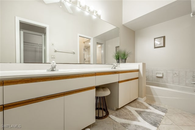 bathroom featuring vanity, tile patterned floors, a bathtub, and ceiling fan