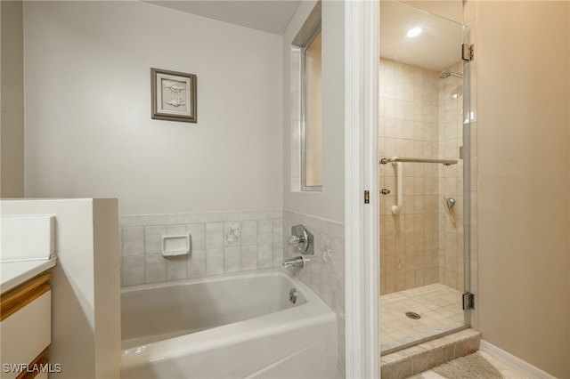 bathroom with plus walk in shower and vanity