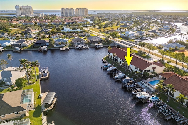 aerial view at dusk with a water view