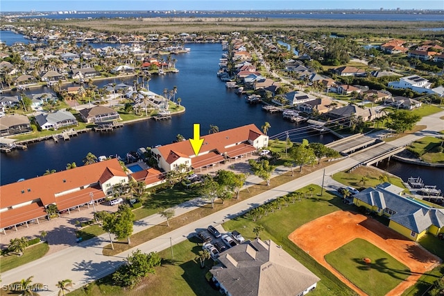 birds eye view of property featuring a water view