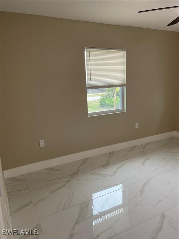 spare room featuring ceiling fan