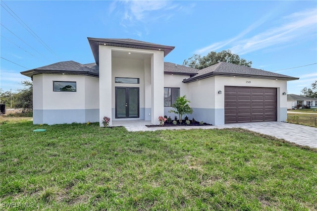 view of front facade with a garage and a front yard