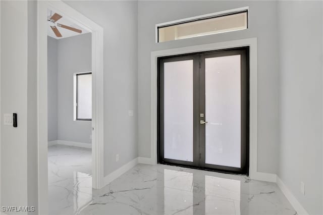 entrance foyer featuring a wealth of natural light, french doors, and ceiling fan