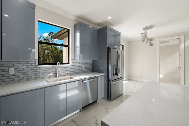 kitchen with appliances with stainless steel finishes, light stone counters, gray cabinetry, sink, and hanging light fixtures