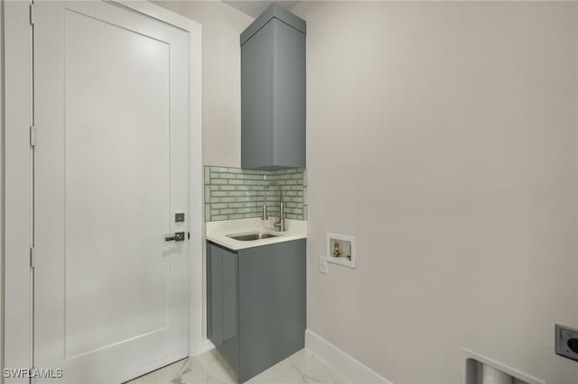 washroom with hookup for an electric dryer, cabinets, sink, and hookup for a washing machine